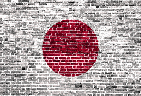 Flag of Japan painted on brick wall, background textureの写真素材