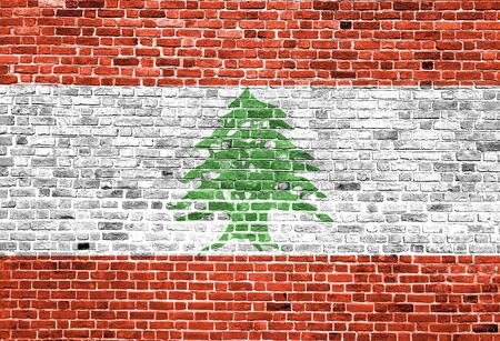 Flag of Lebanon painted on brick wall, background textureの写真素材