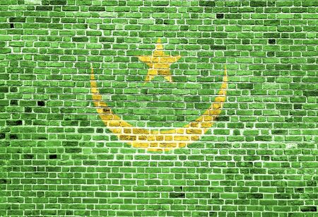 Flag of Mauritania painted on brick wall, background textureの写真素材