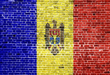 Flag of Moldova painted on brick wall, background textureの写真素材