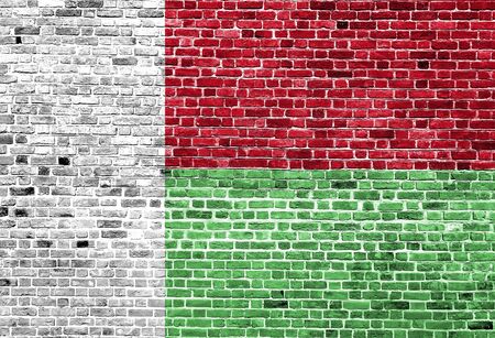 Flag of Madagaskar painted on brick wall, background textureの写真素材