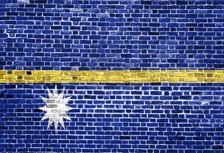 Flag of Nauru painted on brick wall, background textureの写真素材