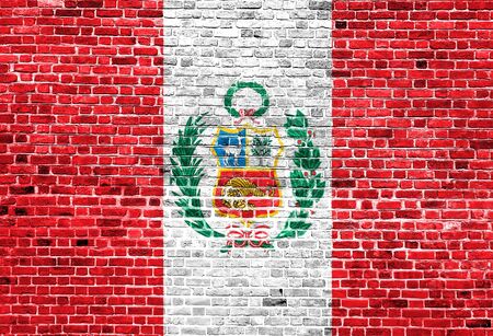 Flag of Peru painted on brick wall, background textureの写真素材