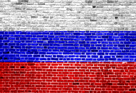 Flag of Russia painted on brick wall, background textureの写真素材