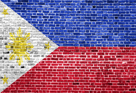 Flag of Phillipines painted on brick wall, background textureの写真素材