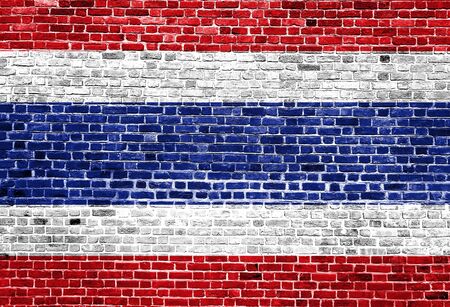 Flag of Thailand painted on brick wall, background textureの写真素材