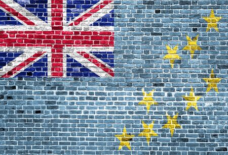 Flag of Tuvalu painted on brick wall, background textureの写真素材