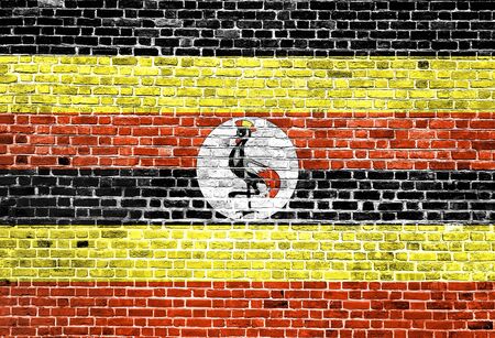 Flag of Uganda painted on brick wall, background textureの写真素材