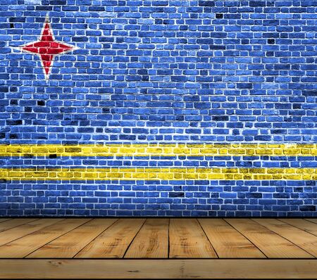 Aruba flag painted on brick wall with wooden floorの写真素材