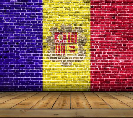 Andorra flag painted on brick wall with wooden floorの写真素材