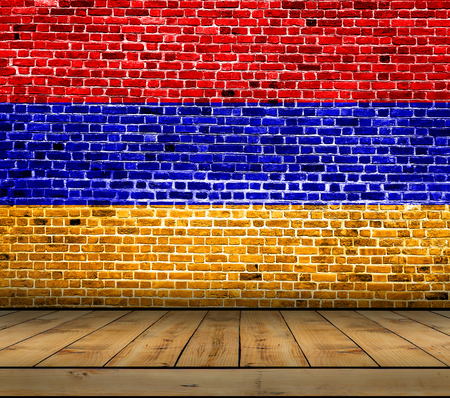 Armenia flag painted on brick wall with wooden floorの写真素材