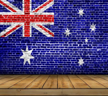 Australia flag painted on brick wall with wooden floorの写真素材