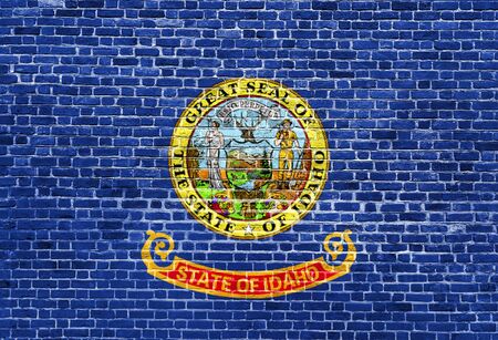 Idaho US flag painted on old vintage brick wallの写真素材