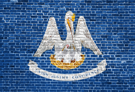 Louisiana US flag painted on old vintage brick wallの写真素材