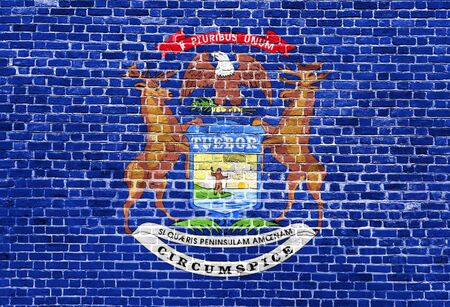 Michigan US flag painted on old vintage brick wallの写真素材