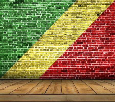 Congo Republic flag painted on brick wall with wooden floorの写真素材