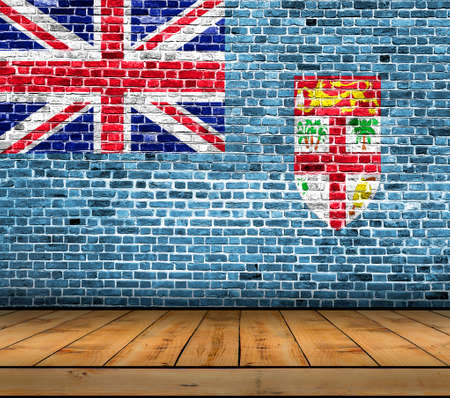 Fiji flag painted on brick wall with wooden floorの写真素材