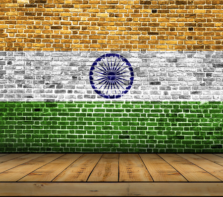 India flag painted on brick wall with wooden floorの写真素材