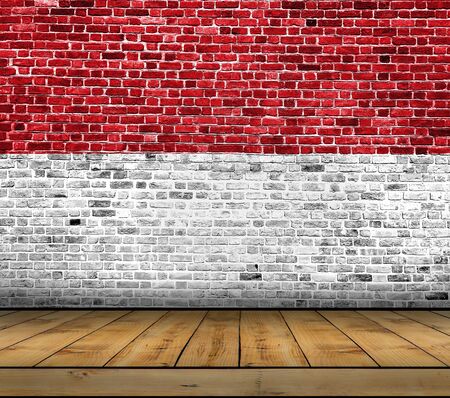 Indonesia flag painted on brick wall with wooden floorの写真素材