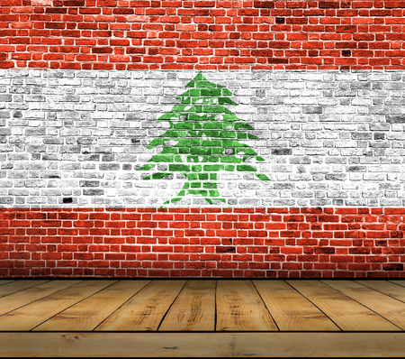 Lebanon flag painted on brick wall with wooden floorの写真素材