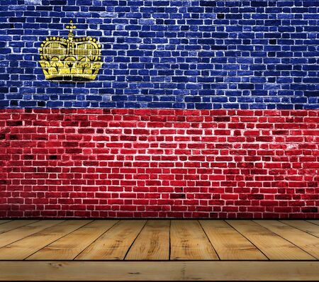 Liechtenstein flag painted on brick wall with wooden floorの写真素材