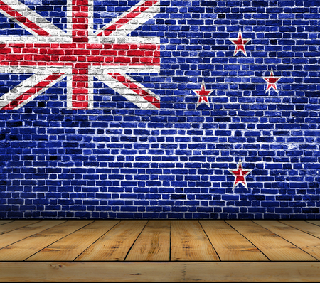New Zealand flag painted on brick wall with wooden floorの写真素材
