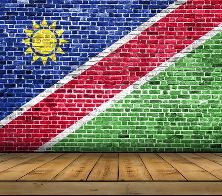 Namibia flag painted on brick wall with wooden floorの写真素材