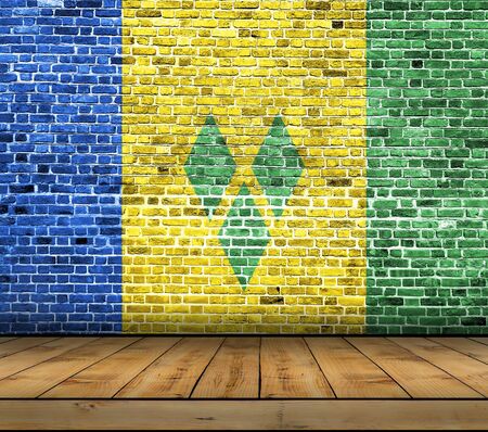Saint Vincent and the Grenadines flag painted on brick wall with wooden floorの写真素材