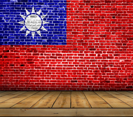 Taiwan flag painted on brick wall with wooden floorの写真素材