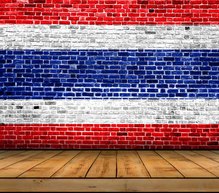 Thailand flag painted on brick wall with wooden floorの写真素材