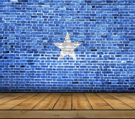 Somalia flag painted on brick wall with wooden floorの写真素材