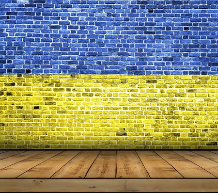 Ukraine flag painted on brick wall with wooden floorの写真素材