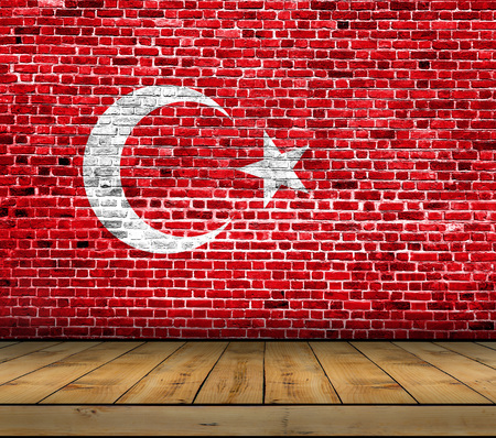 Turkey flag painted on brick wall with wooden floorの写真素材