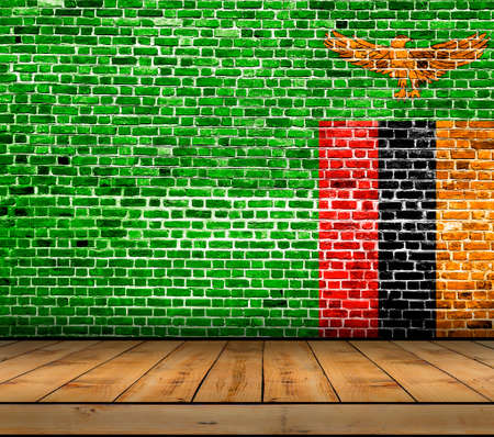 Zambia flag painted on brick wall with wooden floorの写真素材