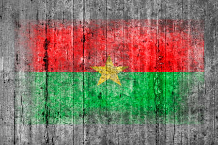 Burkina Faso flag painted on background texture gray concreteの写真素材