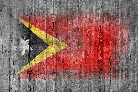 East Timor flag painted on background texture gray concreteの写真素材
