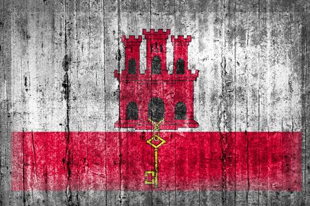 Gibraltar flag on concrete wallの写真素材