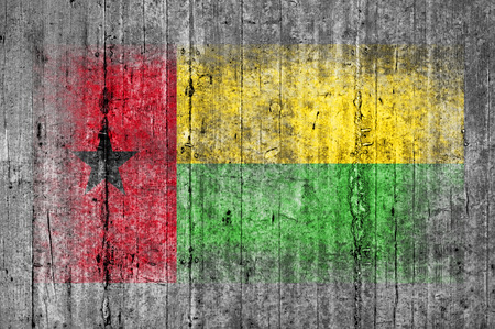 Guinea Bissau flag painted on background texture gray concreteの写真素材
