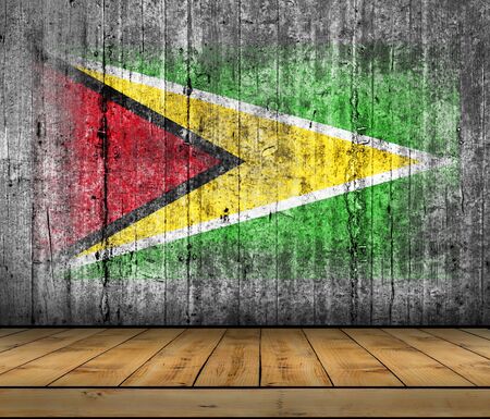 Guyana flag painted on background texture gray concrete with wooden floorの写真素材