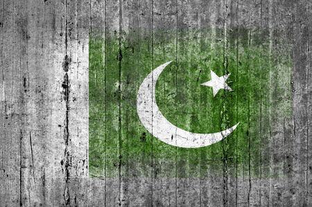 Pakistan flag painted on background texture gray concreteの写真素材