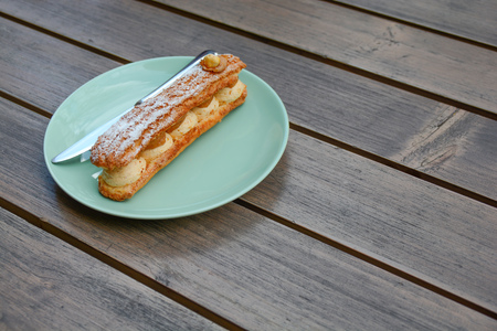 Hazelnut cream Paris Brest fresh sweet yummy treat on wooden tableの写真素材
