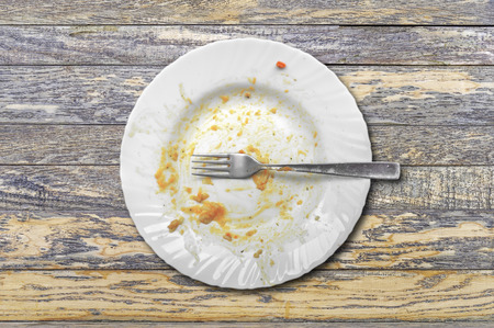 View from above on empty plate, dirty after the meal is finishedの写真素材