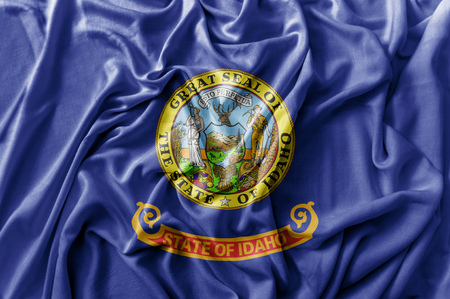 Ruffled waving United States Idaho flagの写真素材