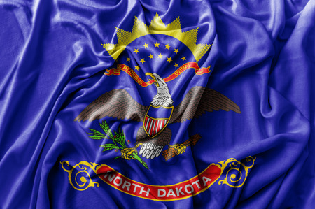 Ruffled waving United States North Dakota flagの写真素材