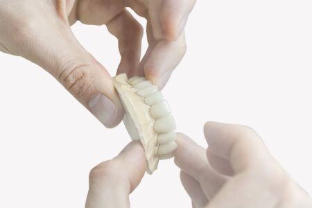 Prostetic tooth dentist technician working on laboratoryの写真素材