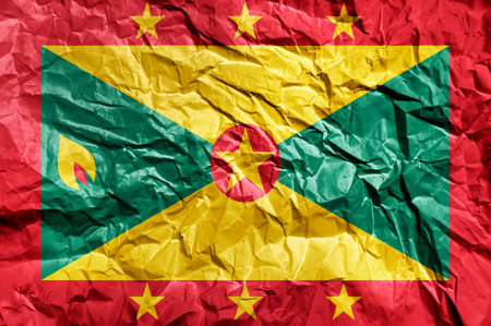 Grenada flag painted on crumpled paper backgroundの写真素材