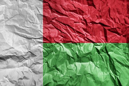 Madagascar flag painted on crumpled paper backgroundの写真素材