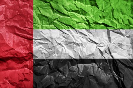 United Arab Emirates flag painted on crumpled paper backgroundの写真素材
