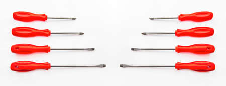 Eight red shiny metal and plastic tool screwdriver for repairの写真素材