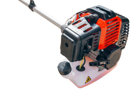 Motor of lawnmower trimmer for grass like garden machine on white